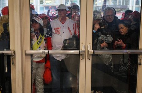 Trump fans endure frigid temps, sleet and snow for a chance to see president-elect